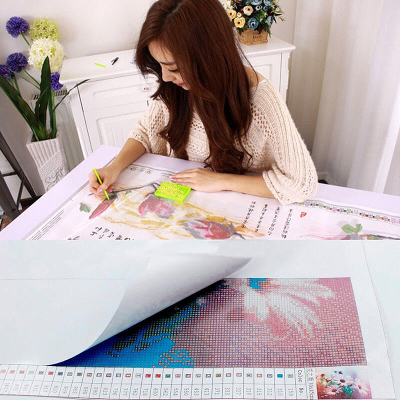 A woman relaxing while crafting a diamond painting